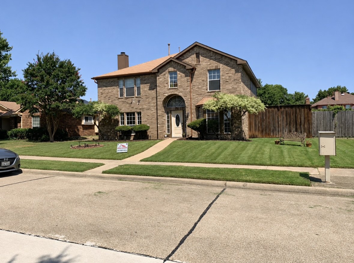 Neatly maintained front lawn at a brick home