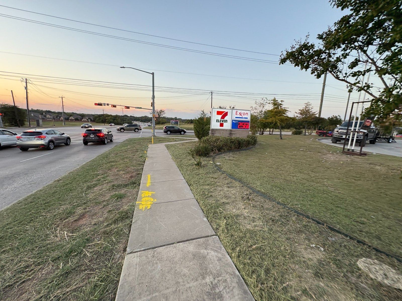 Grass and landscaped area beside a sidewalk